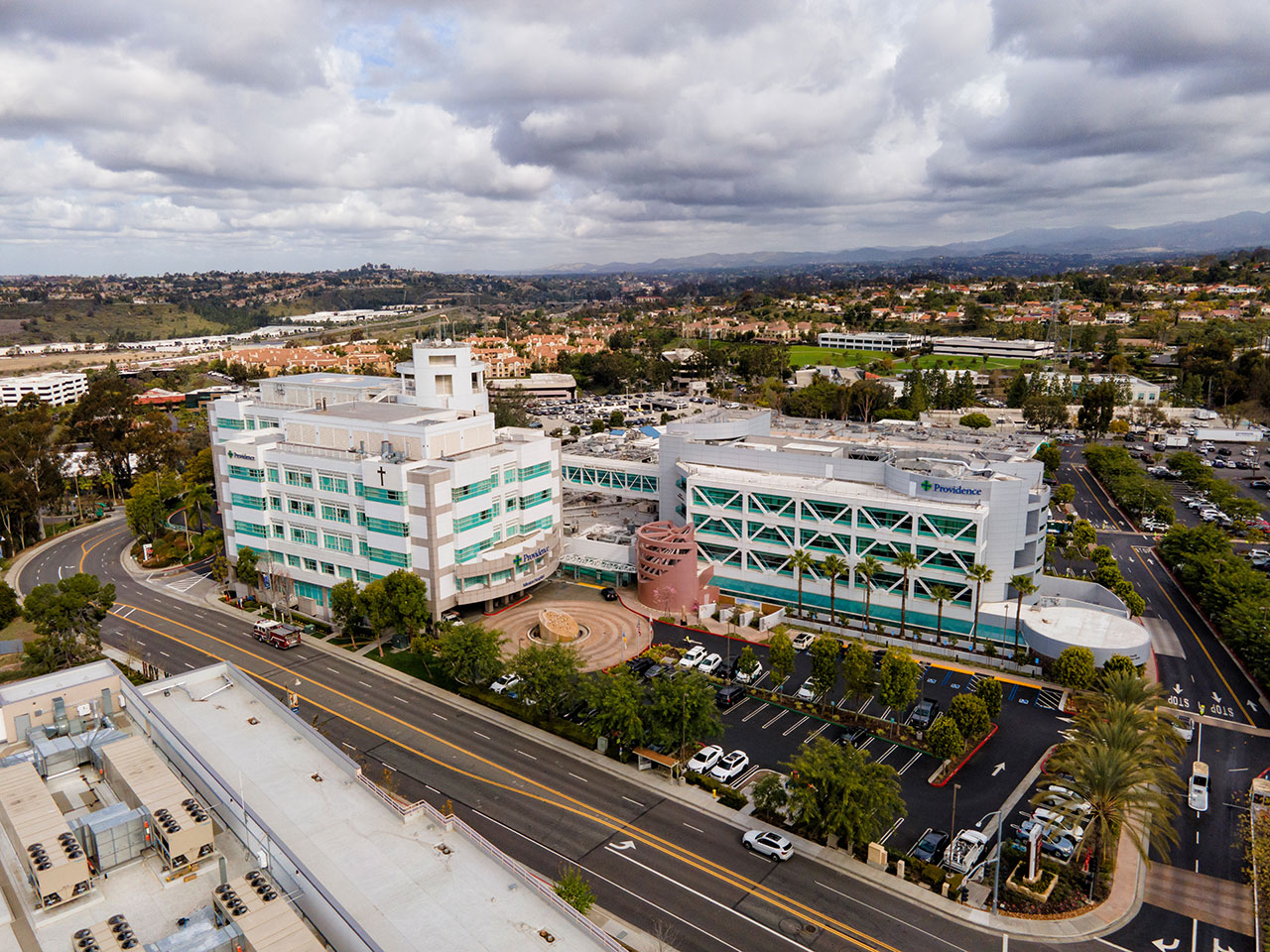 tall hospital building surrounded by a residential area